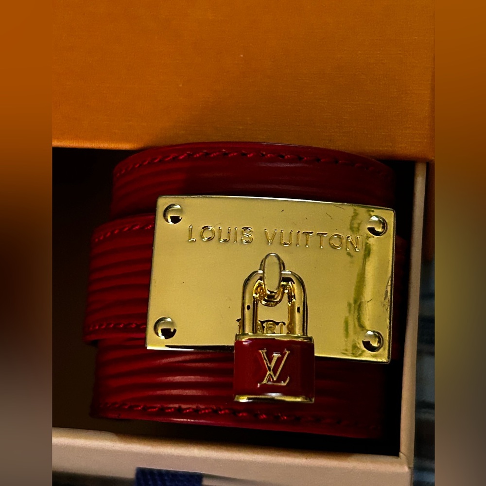 Authentic Louis Vuitton cuff bracelet in red Epi leather.